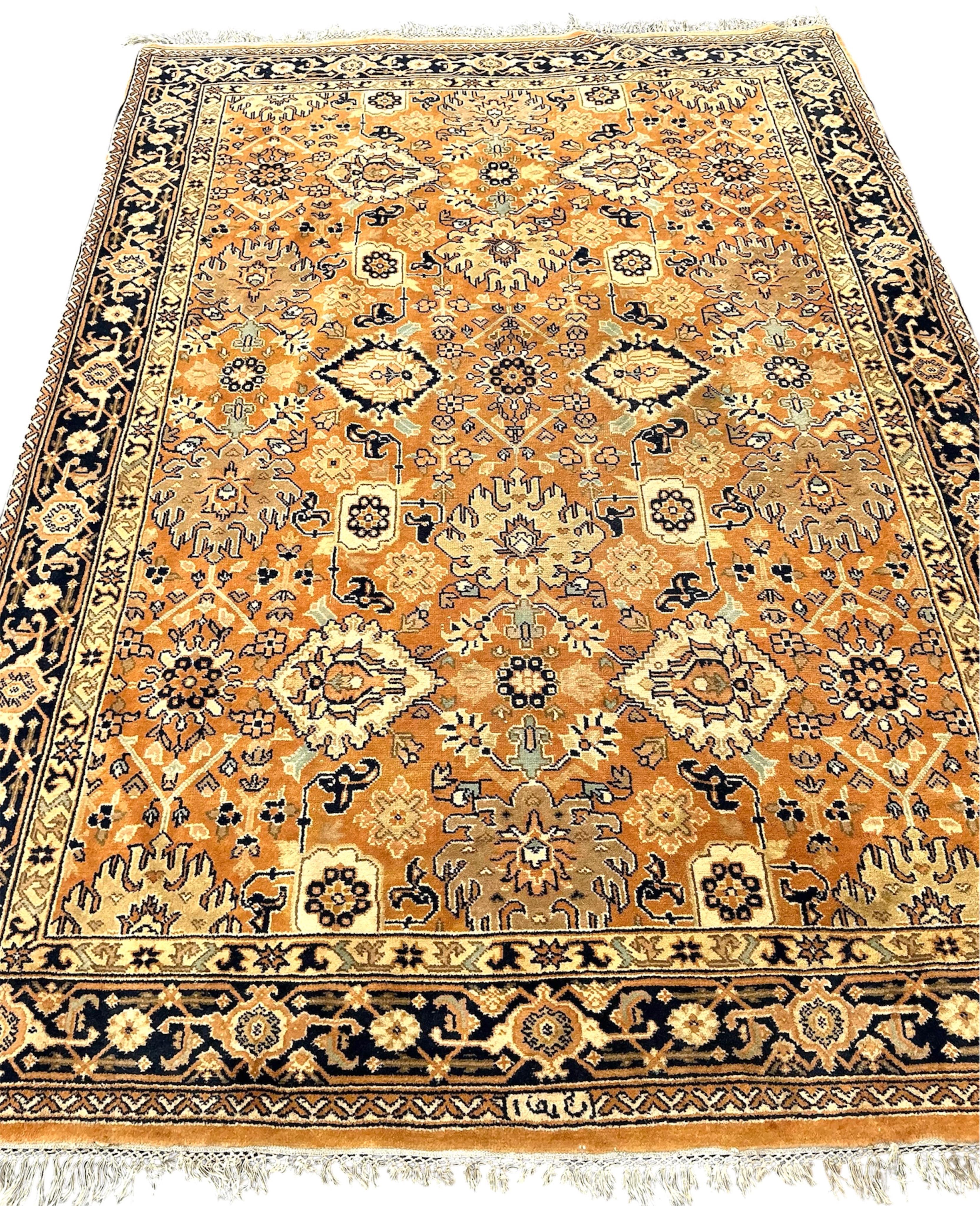 A North West Persian style peach ground carpet, 230 x 168cm